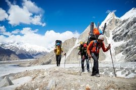 David Lama, Peter Ortner and Hansjörg Auer hiking up the Masherbrum.